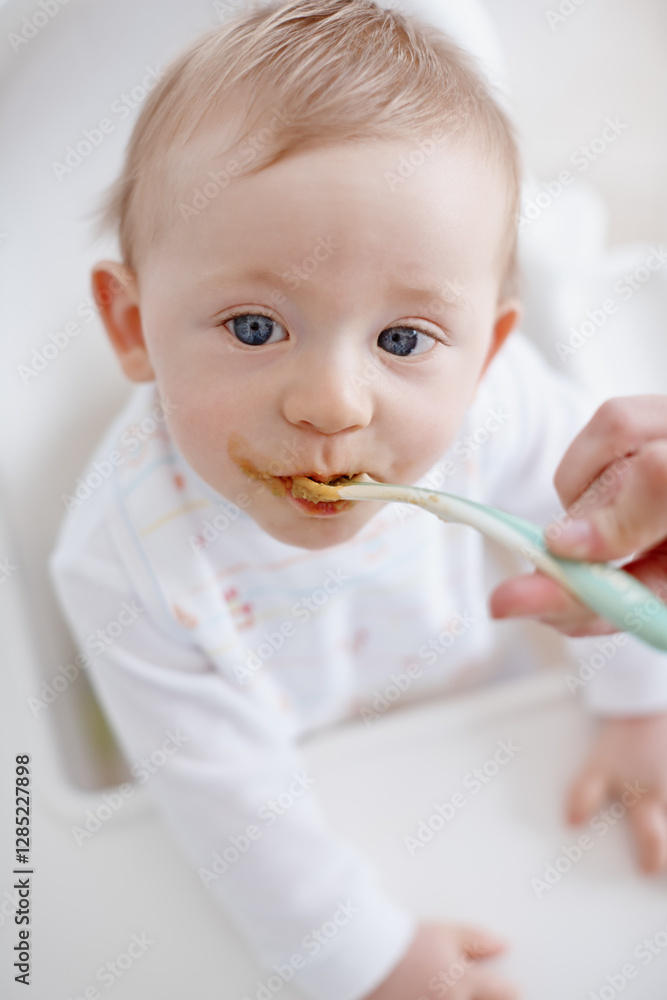 Baby nutrition, parent and hands feeding in home, hungry and love to support with child development. Food, high chair and helping son to eat, childcare and healthy meal for infant diet or wellness Baby nutrition, parent and hands feeding in home, hungry and love to support with child development. Food, high chair and helping son to eat, childcare and healthy meal for infant diet or wellness