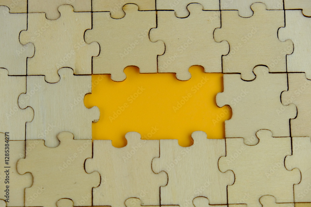 white jigsaw puzzle with missing puzzle for a text template. Above photo of isolated on the background white jigsaw puzzle with missing puzzle for a text template. Above photo of isolated on the background