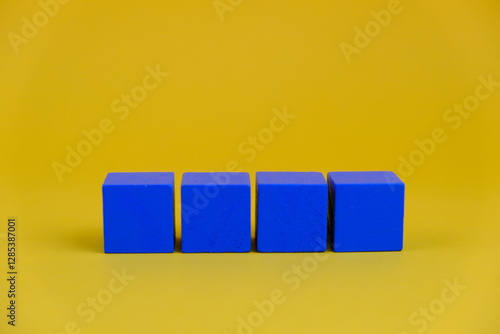  alarm clock and four blank wooden cubes for text concept.  photo