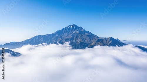 Mountain Top with Serene Clouds on Crystal-Clear Blue Sky