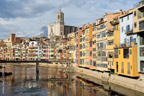 Wallpaper Mural Girona Spain - 25 April 2024 - Colourful houses along Onyar River in front of cathedral in Girona Torontodigital.ca