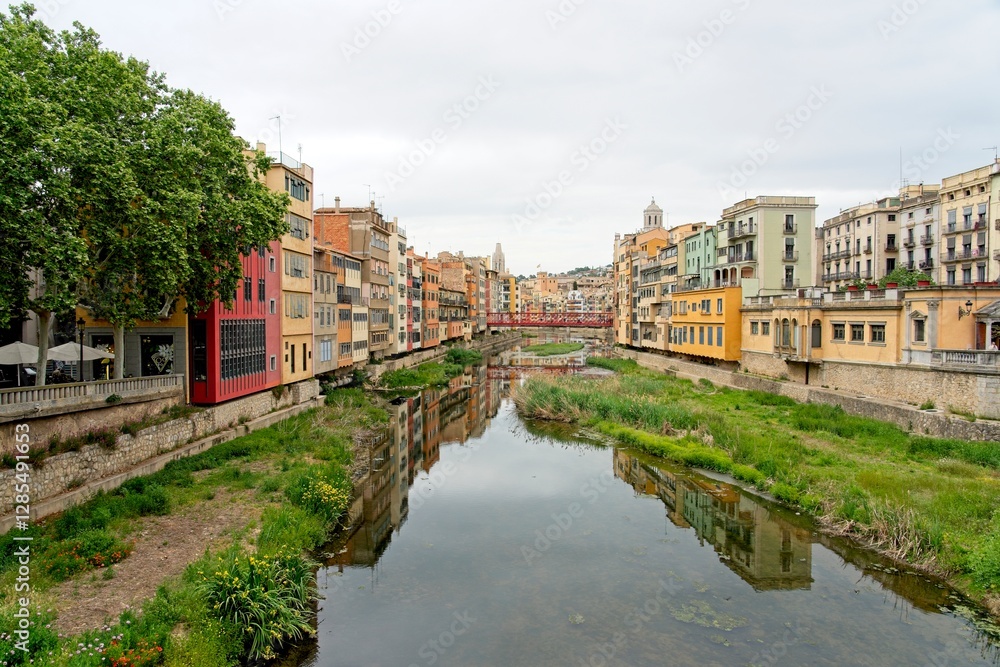 Girona Spain - 25 April 2024 - Colourful houses along the Onyar River in Girona Girona Spain - 25 April 2024 - Colourful houses along the Onyar River in Girona