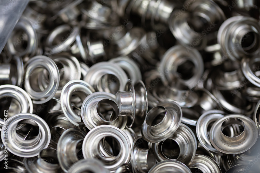A Detailed CloseUp of Metallic Grommets and Eyelets for Various Crafting Projects and Activities A Detailed CloseUp of Metallic Grommets and Eyelets for Various Crafting Projects and Activities