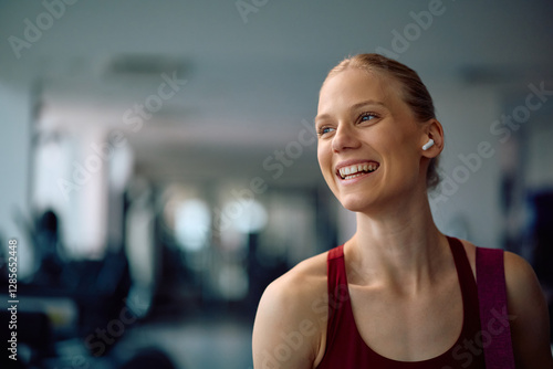 Happy athletic woman having sports training at health club. Free Download Happy athletic woman having sports training at health club. - GFXLoad