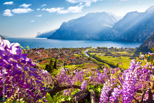 Obraz na płótnie Town of Torbole and Lago di Garda sunset view w salonie