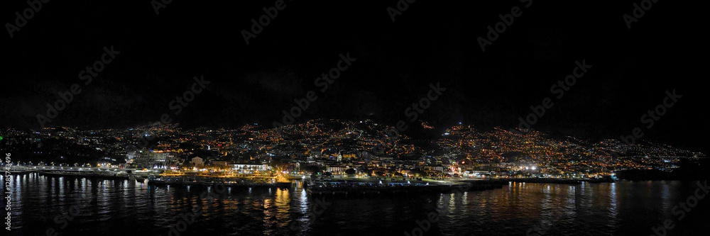 Fototapeta premium Panorama of the cruise port and city of Funchal at night from a cruise ship