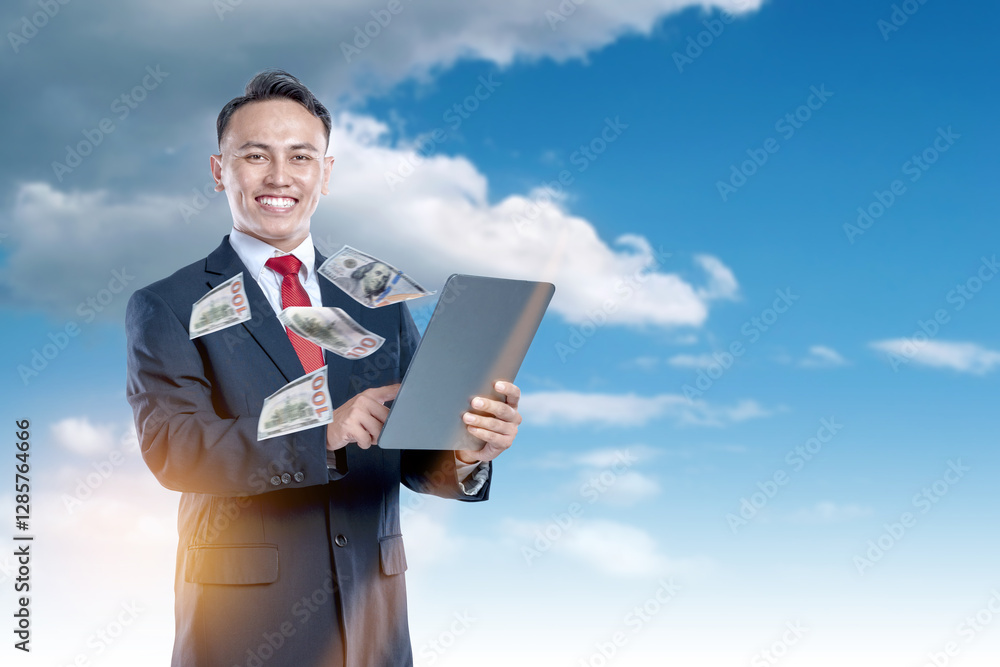 A businessman using a tablet with flying money comes out from the screen. Concept of business, finance, and economy A businessman using a tablet with flying money comes out from the screen. Concept of business, finance, and economy