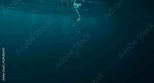 Fototapeta Naklejka Na Ścianę i Meble -  Underwater deep ocean background. Dark teal and deep blue hues. Floating bubbles, light refraction, gentle waves