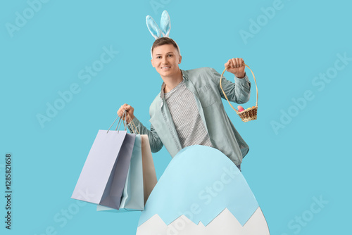 Young man in bunny ears wit...