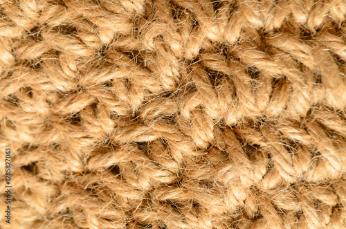 Woven jute fabric texture closeup with natural fibers