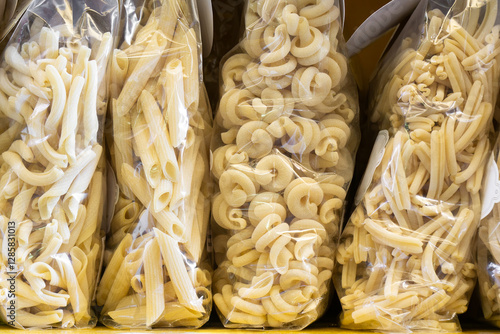Italian pasta di Gragnano displayed in plastic bags in a store