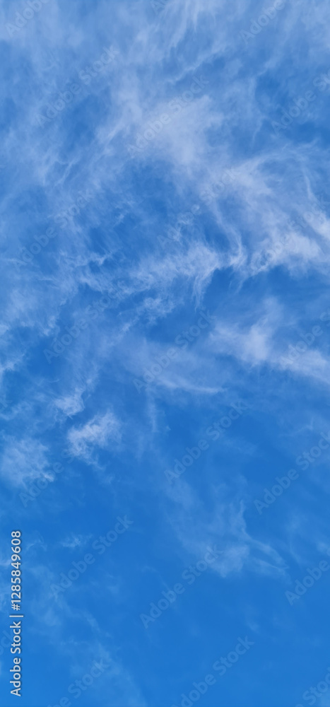 Vertical blue sky photography with white clouds Vertical blue sky photography with white clouds