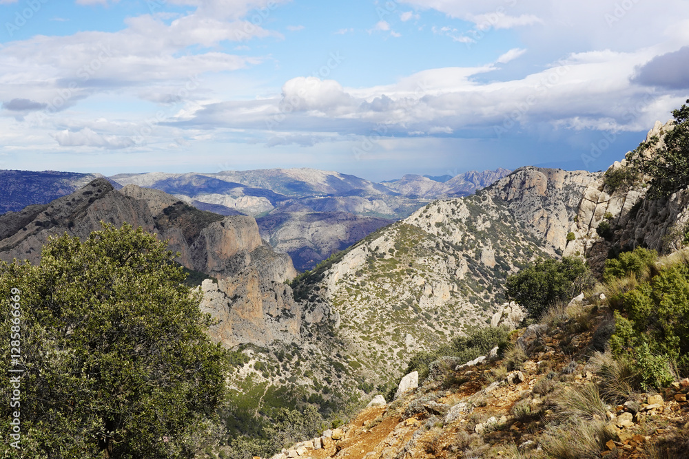 The mountain panorama opening from the hiking path to pick Puig Campana, Finestrat, Benidorm, Spain The mountain panorama opening from the hiking path to pick Puig Campana, Finestrat, Benidorm, Spain