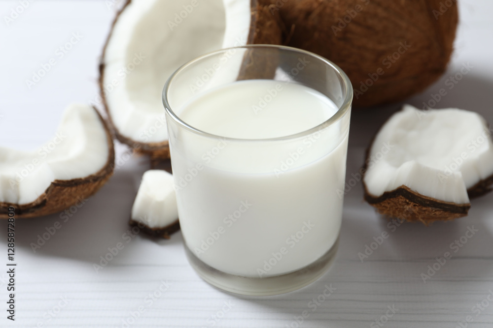 Glass of milk with coconuts on the table