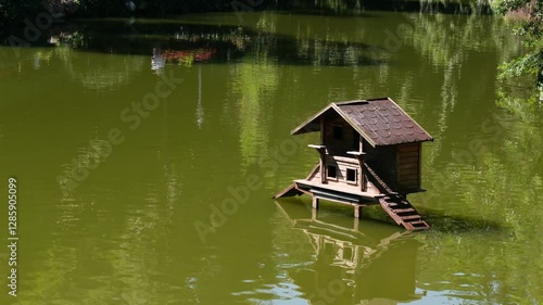 Tranquil Birdhouse Floating on a Serene Lake