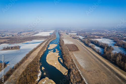 Rzeka Odra zimą z lotu ptaka z piaszczystymi wyspami w okolicach Polderu Buków. photo