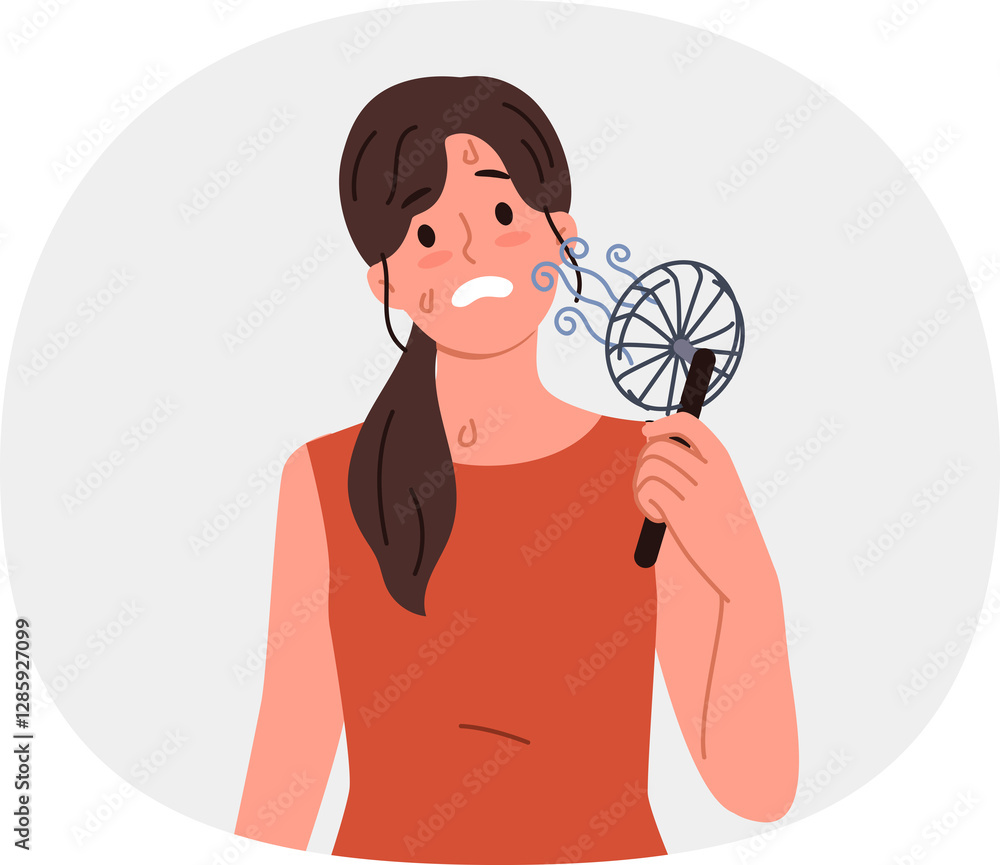 Woman uses electric fan to stop sweating and prevent exhaustion in hot summer weather. Small electric fan inside girl suffering from warming temperatures and lack of air conditioning