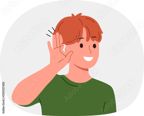 Boy uses hearing aid and puts palm to ear, rejoicing at availability of technological solutions to health problems. Schoolboy with hearing aid smiles listening to sounds around him.