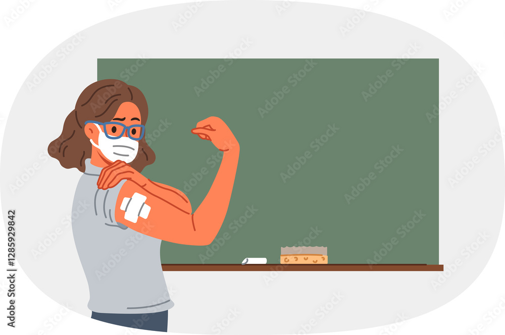 Vaccinated female teacher demonstrates patch at injection site on arm, standing near school board. Vaccinated girl teacher recommends taking preventive measures to protect against virus