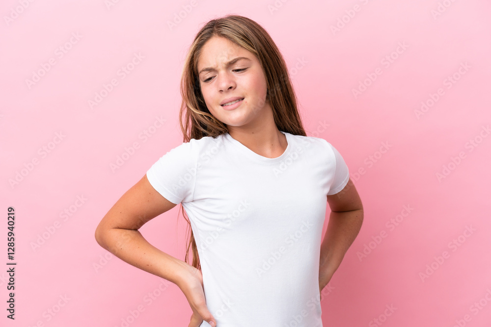 Little caucasian girl isolated on pink background suffering from backache for having made an effort Little caucasian girl isolated on pink background suffering from backache for having made an effort
