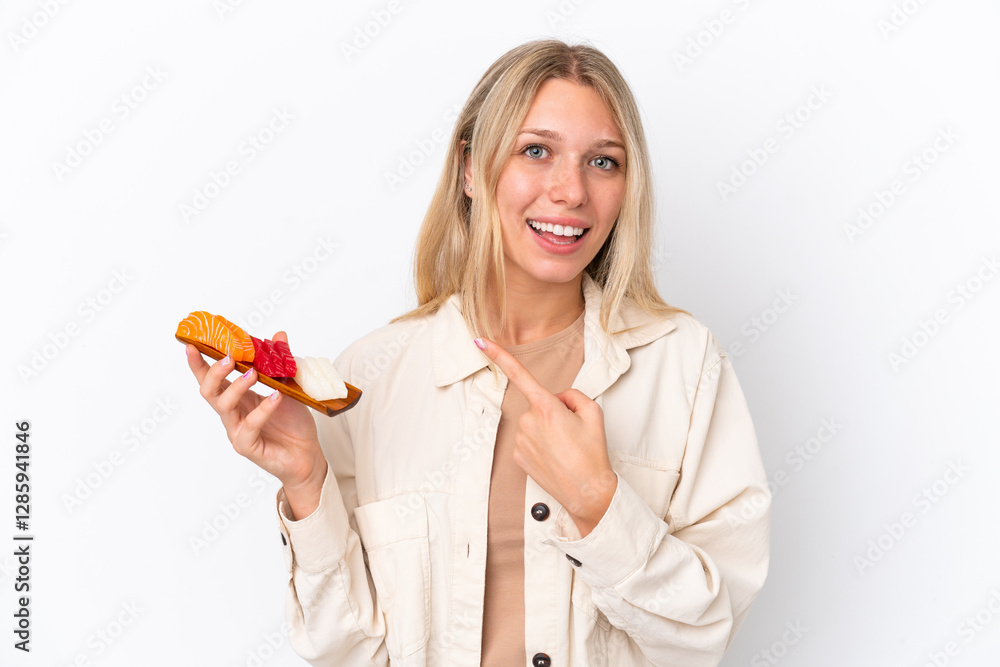 Young caucasian woman holding sashimi isolated on white background pointing to the side to present a product Young caucasian woman holding sashimi isolated on white background pointing to the side to present a product