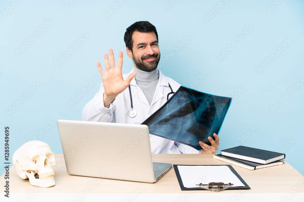 Professional traumatologist in workplace counting five with fingers Professional traumatologist in workplace counting five with fingers