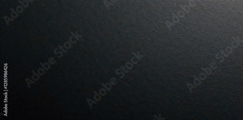 Black textured paper sheet, fine grain detail, surface texture, design element
