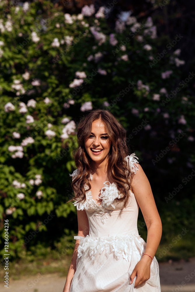 Stunning bride gracefully poses in a spring park, among blossoming trees. exuding elegance, Stunning bride gracefully poses in a spring park, among blossoming trees. exuding elegance,