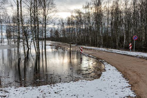 Obraz na płótnie latvian winter landscape with flooded lake, thin and light ice in places, reflections w salonie