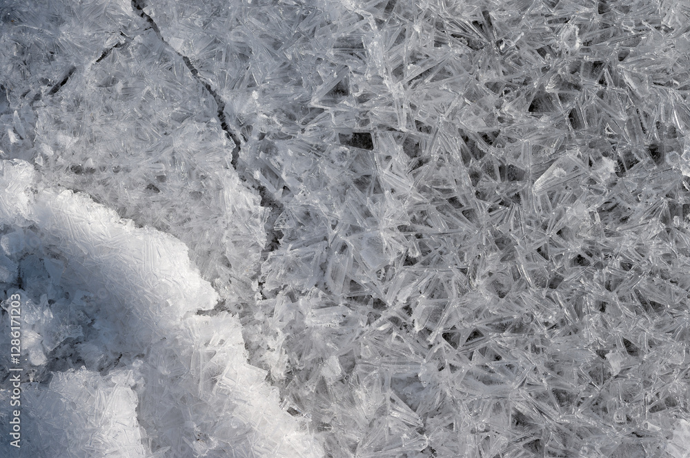 Fototapeta premium Frozen stream and ice closeup photo. Beautiful winter abstract background in nature. Concept for water and winter time.