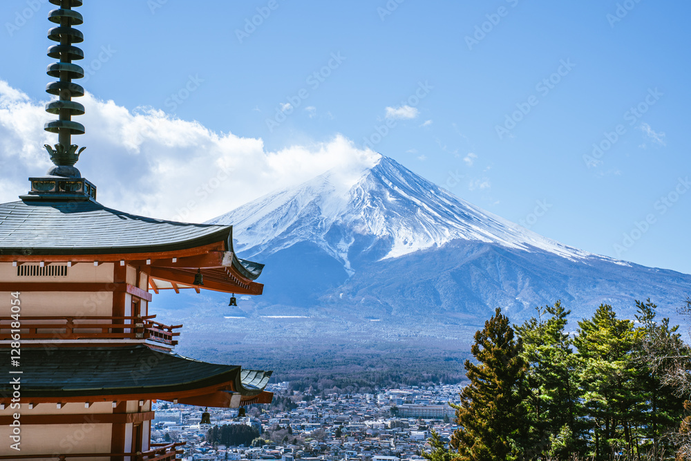 Mount Fuji scenery There is a red Chureito Pagoda and trees in the foreground on a clear day. Mount Fuji scenery There is a red Chureito Pagoda and trees in the foreground on a clear day.
