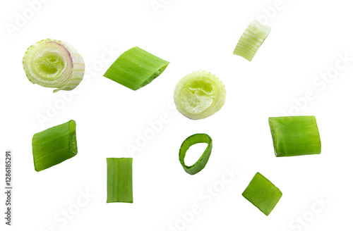 Falling green onion slices, fresh cut chives isolated on white background