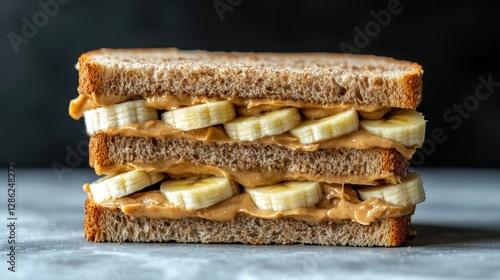 Peanut Butter & Banana Sandwich: Close-up of a classic peanut butter and banana sandwich, showcasing the simple ingredients and enticing textures. A delicious and satisfying snack or meal