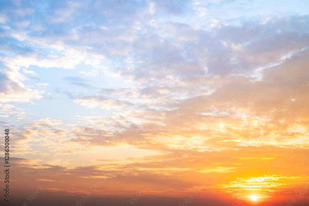 Beautiful , luxury soft gradient orange gold clouds and sunlight on the blue sky perfect for the background, take in evening,Twilight, Large size, high definition landscape photo Beautiful , luxury soft gradient orange gold clouds and sunlight on the blue sky perfect for the background, take in evening,Twilight, Large size, high definition landscape photo