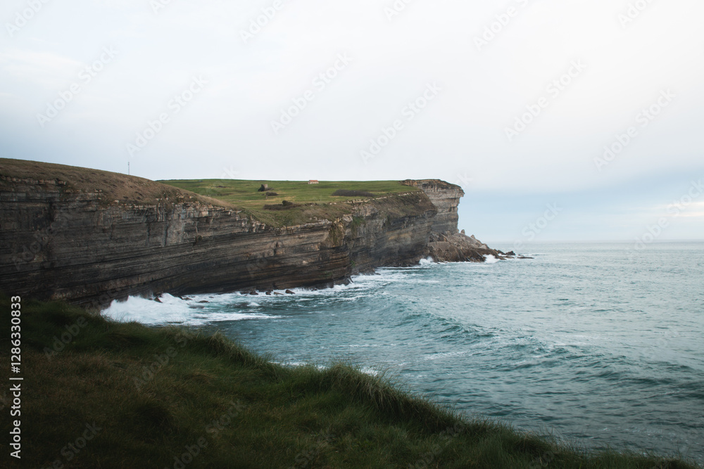 Coastline with cliffs and grass fields in northern Spain. Coastline with cliffs and grass fields in northern Spain.