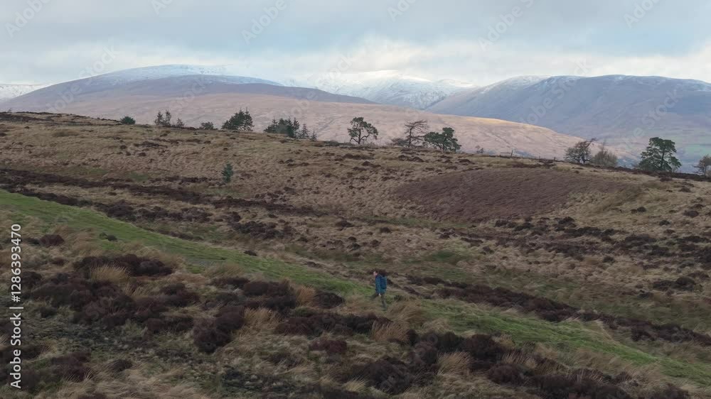 Drone aerial single male hiker Scottish highlands loch lomond Drone aerial single male hiker Scottish highlands loch lomond