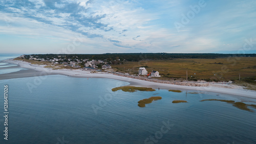 Sandy beach with coastal houses along the shoreline in Cape Cod, USA. photo