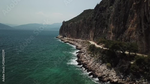 Breathtaking coastal walk along rocky cliffs with clear blue waters in scenic landscape
