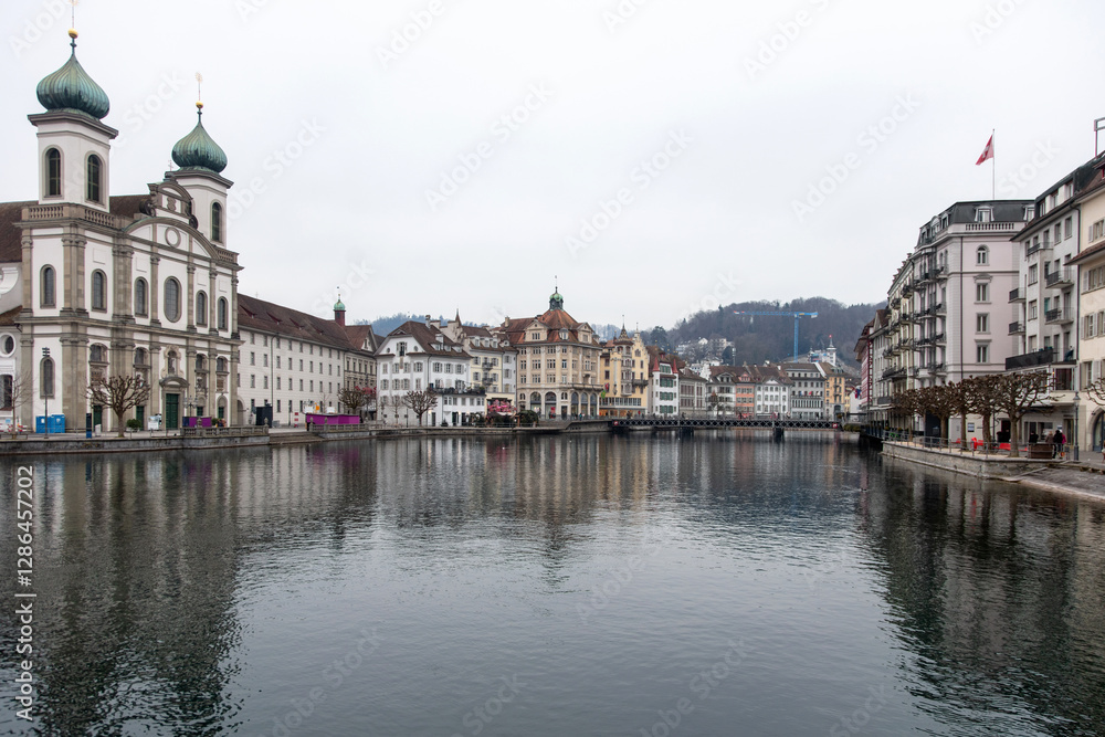 Switzerland, Lucerne. Old city, Altstadt. Jesuit Church and other historic buildings on the banks of Reuss River. Switzerland, Lucerne. Old city, Altstadt. Jesuit Church and other historic buildings on the banks of Reuss River.