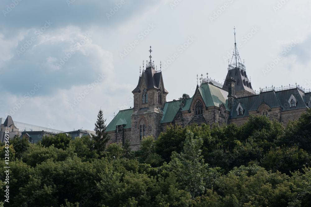 Close-up of a historic Parliament building with gothic architecture and green copper roofs in Ottawa, Canada. Close-up of a historic Parliament building with gothic architecture and green copper roofs in Ottawa, Canada.