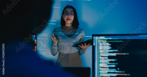 Group adult Asia female software developer mentor leader manager talk strategy plan to executive write prompt AI bot IT app program nomad, video game, designer, data center. Projecting slideshow code.