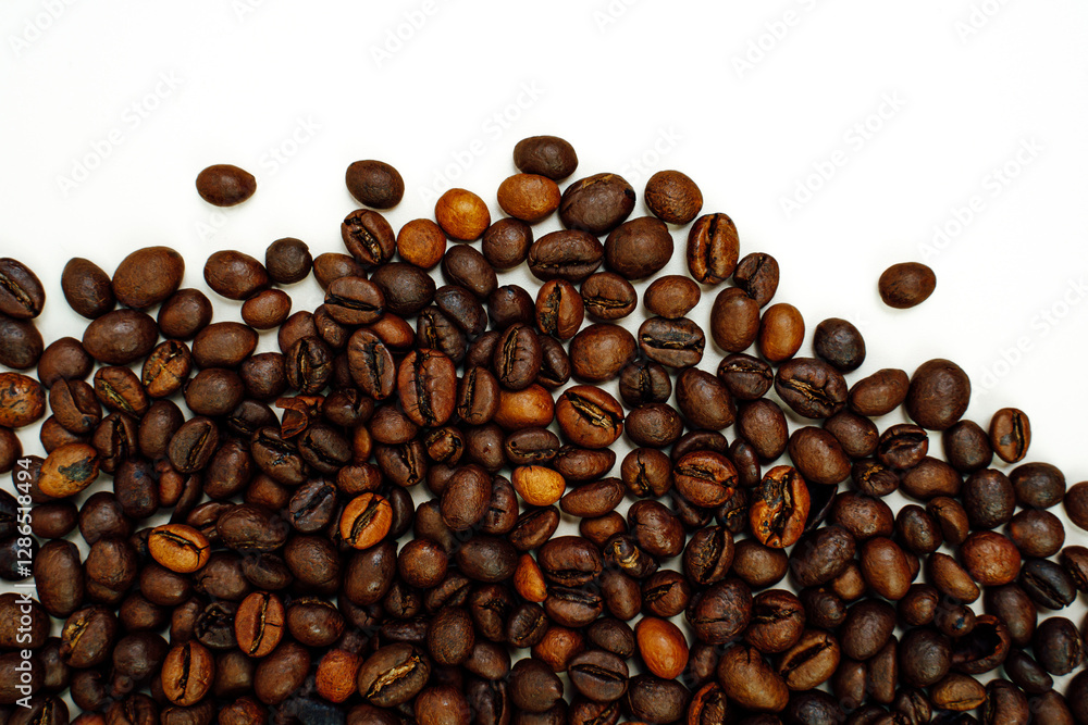 Obraz premium Coffee beans on a white background. Close-up. Space for text