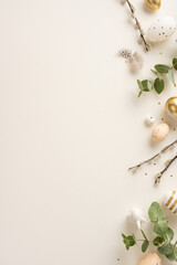 Flat lay vertical image featuring Easter decorations with golden and white eggs, willow branches, and greenery creating a balanced and festive composition on a neutral background