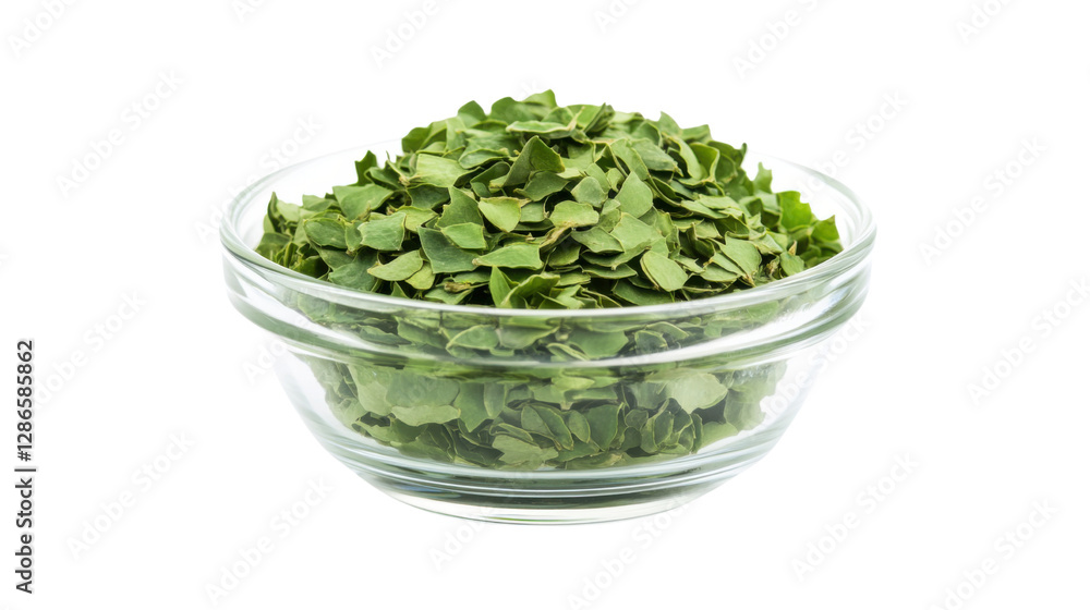 Glass bowl filled with dried moringa leaves isolated on white background Glass bowl filled with dried moringa leaves isolated on white background