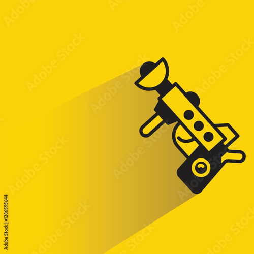 futuristic blaster gun on yellow background