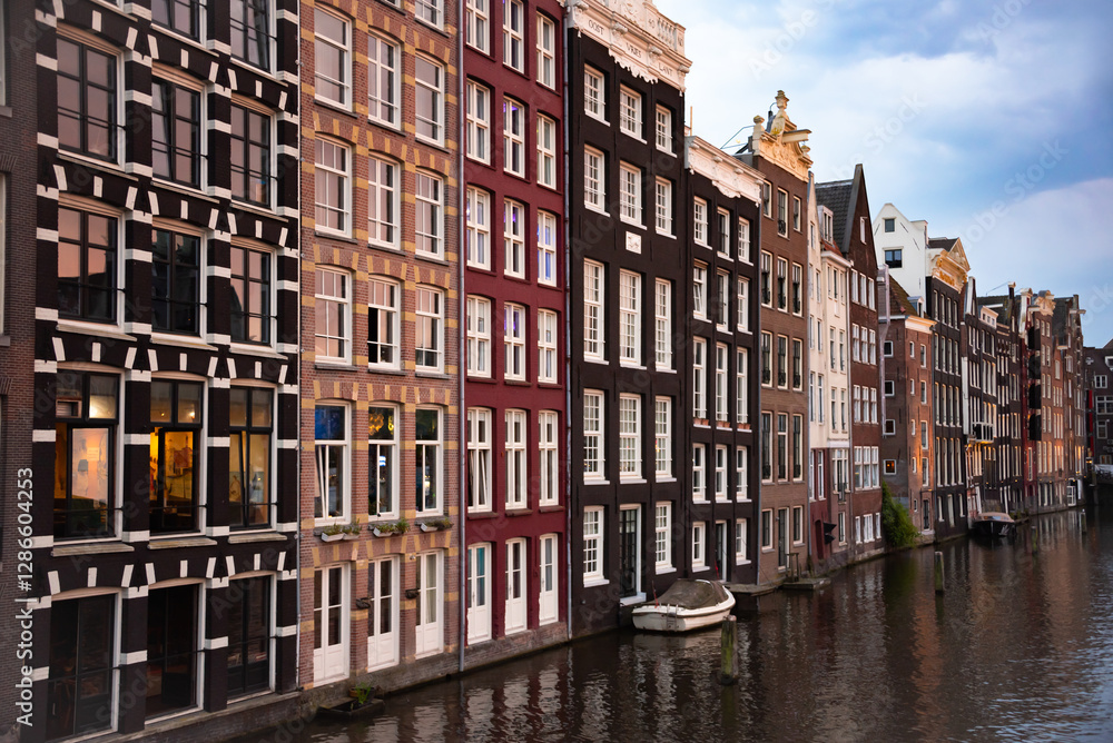Naklejka premium Amsterdam city, Netherlands. Typical Dutch houses on canal