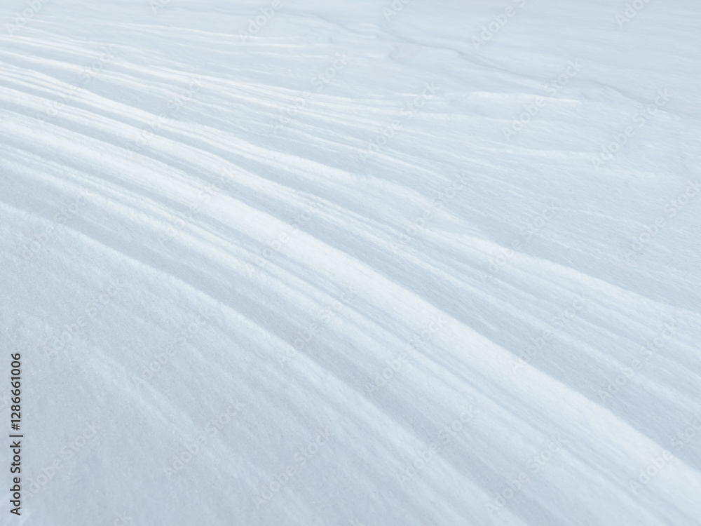 white abstract background of close-up natural snow texture. snow pattern. snow surface. nature pattern. abstract nature. linear pattern white abstract background of close-up natural snow texture. snow pattern. snow surface. nature pattern. abstract nature. linear pattern