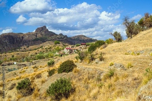 Olive groves and mountains around Ghost Town, Pentedattilo Village, Calabria, Italy, Europe photo