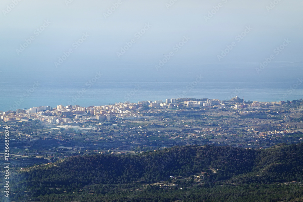 The panorama opening from the pick Puig Camapan in the direction of Benidorm and sea, Spain The panorama opening from the pick Puig Camapan in the direction of Benidorm and sea, Spain