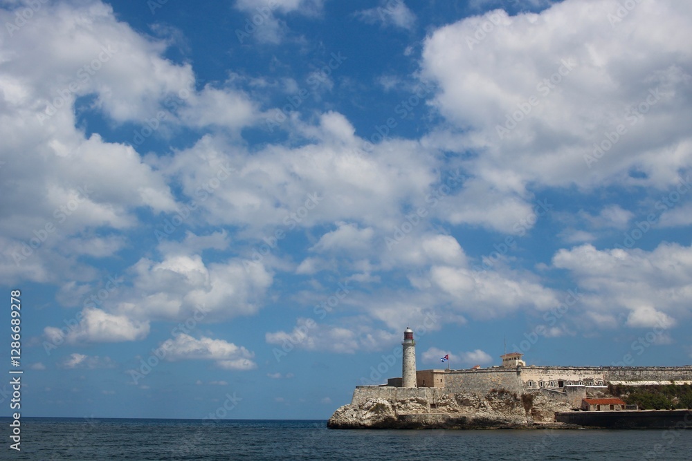 Historic lighthouse El Morro on a rocky coast under a beautiful cloudy sky, Cuba
Historic lighthouse El Morro on a rocky coast under a beautiful cloudy sky, Cuba